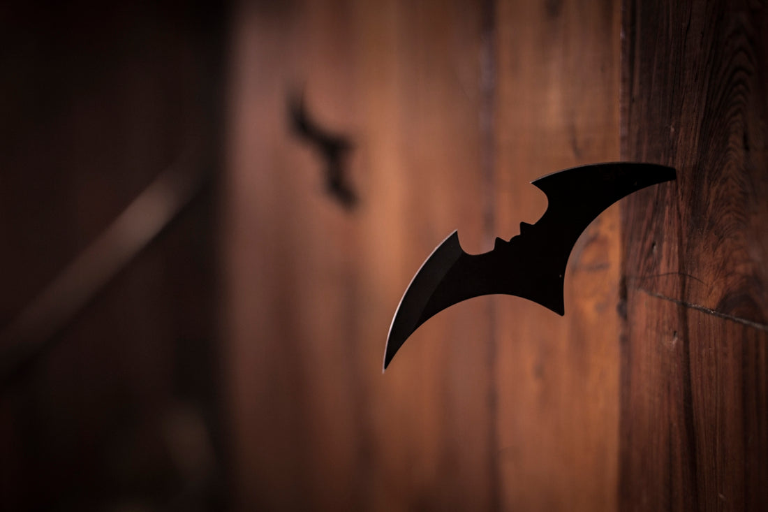 closeup photo of shuriken on wood
